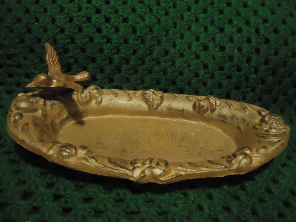 CAST IRON BIRD FEEDER WITH BIRD PERCHED ON SIDE..DECORATIVE BORDER...
