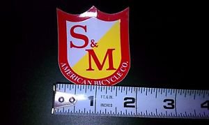 S&M Shield Sticker Red Yellow White 1 7/8 W x 2 1/4 Tall Gloss First Class