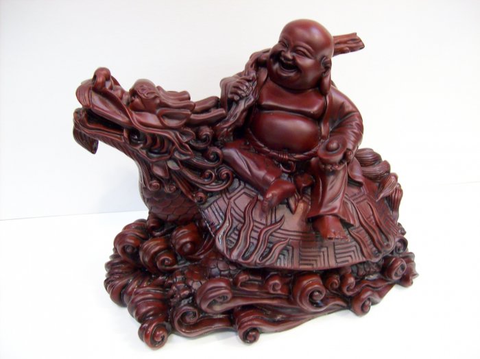 Laughing Buddha on Dragon