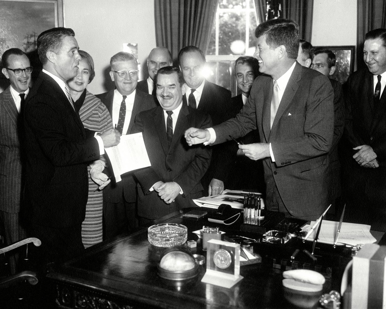 JOHN F. KENNEDY SIGNS PEACE CORPS BILL w/ SARGENT SHRIVER - 8X10 PHOTO (AB-143)