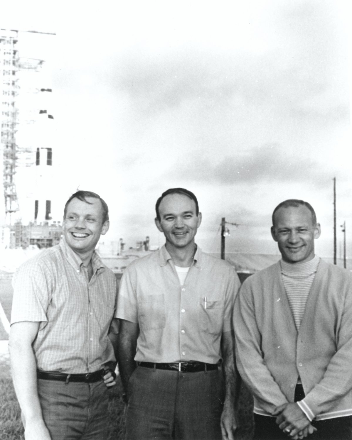 APOLLO 11 CREW STANDS NEAR SATURN V ROCKET - 8X10 NASA PHOTO (EP-504)
