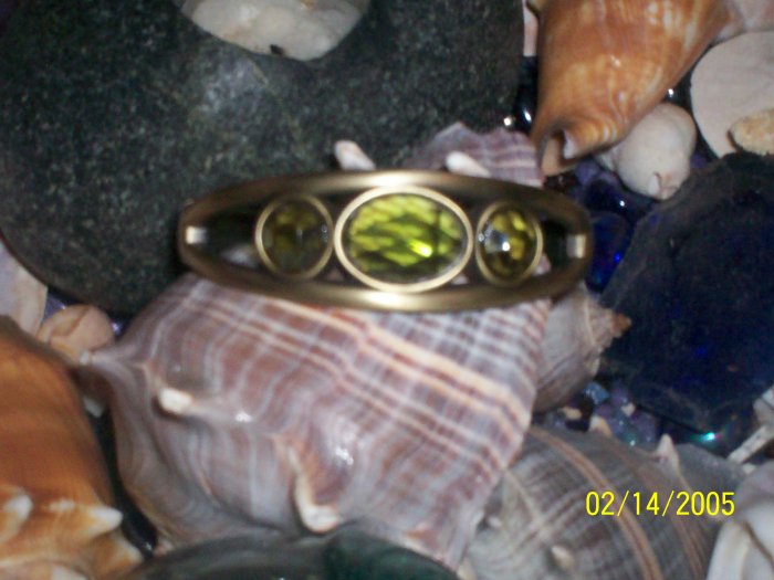 Brass bangle with green peridots