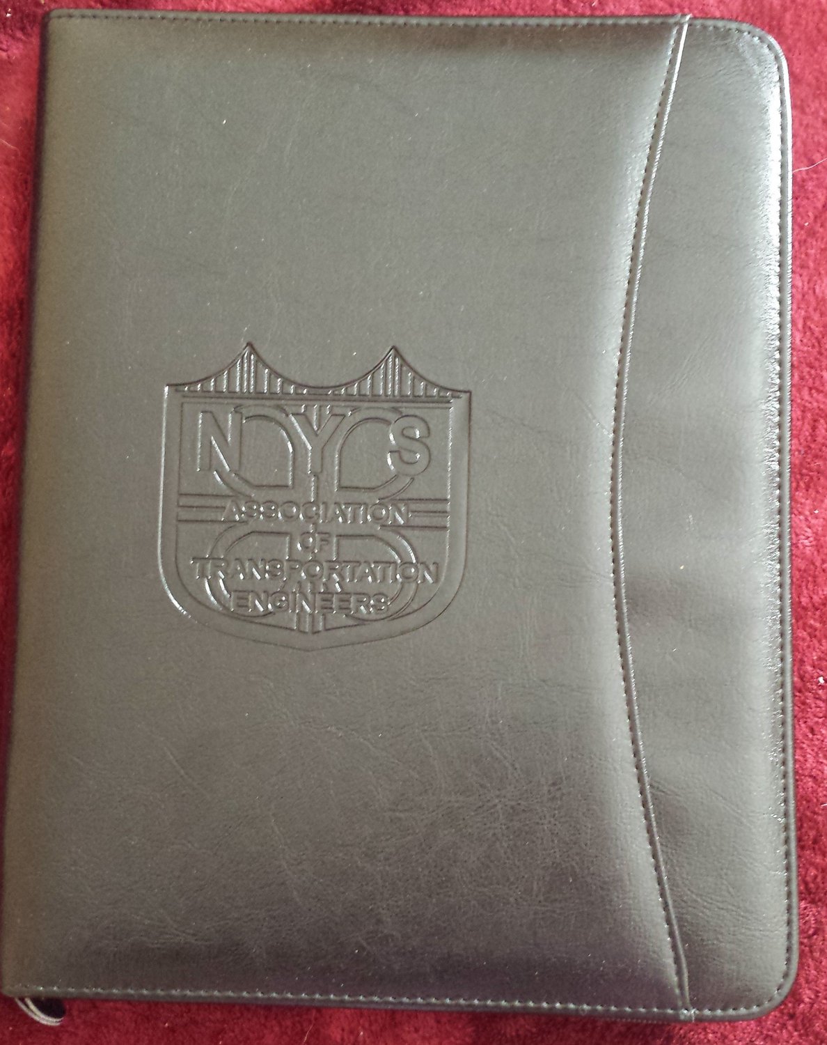 Black zippered padfolio with NYSATE logo