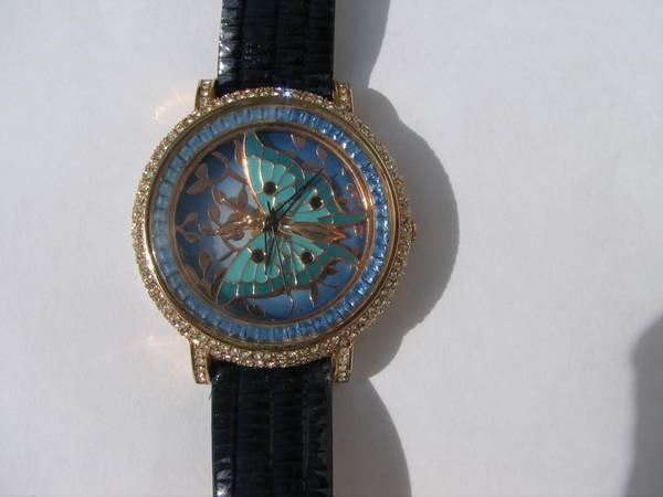 Luxury watch with blue and white cz stones