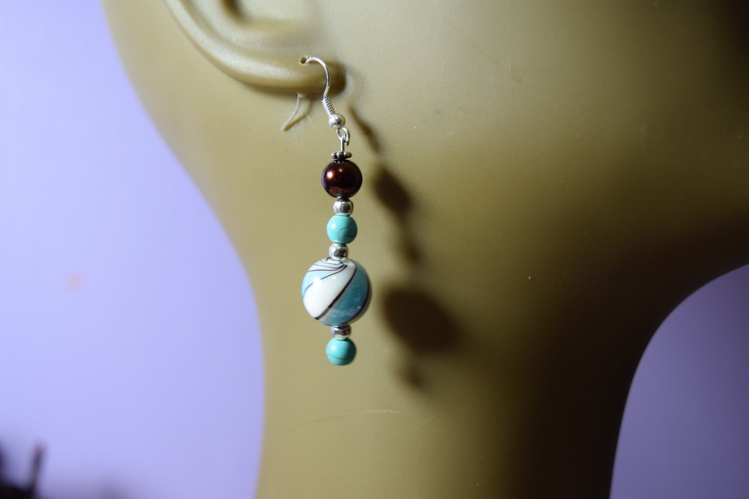 marble shaped blue and white swirl w/ bronze bead