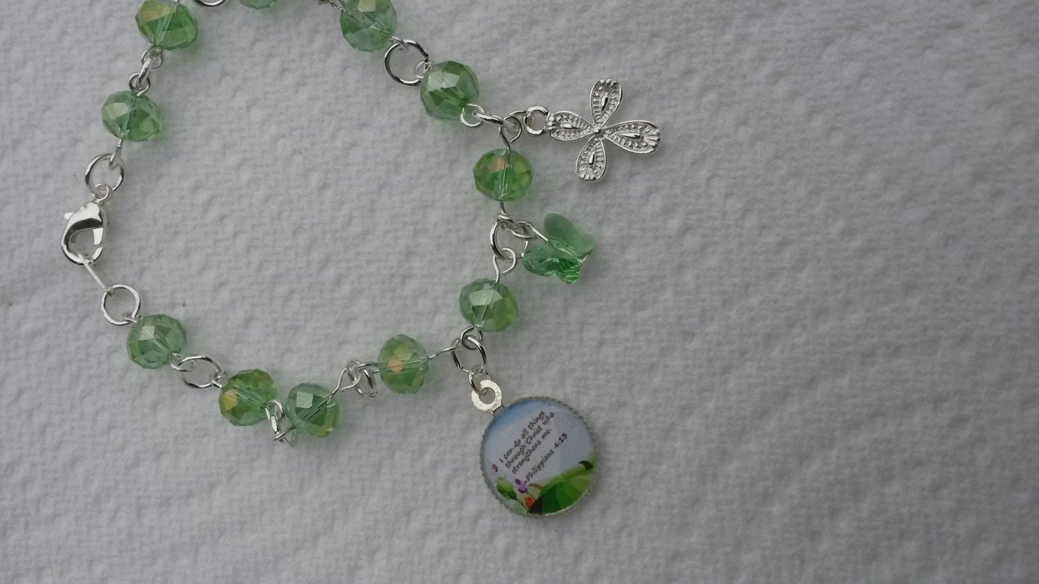 A lovely Bible verse bracelet made with stunning peridot green Czech glass and heavy gauge findings.