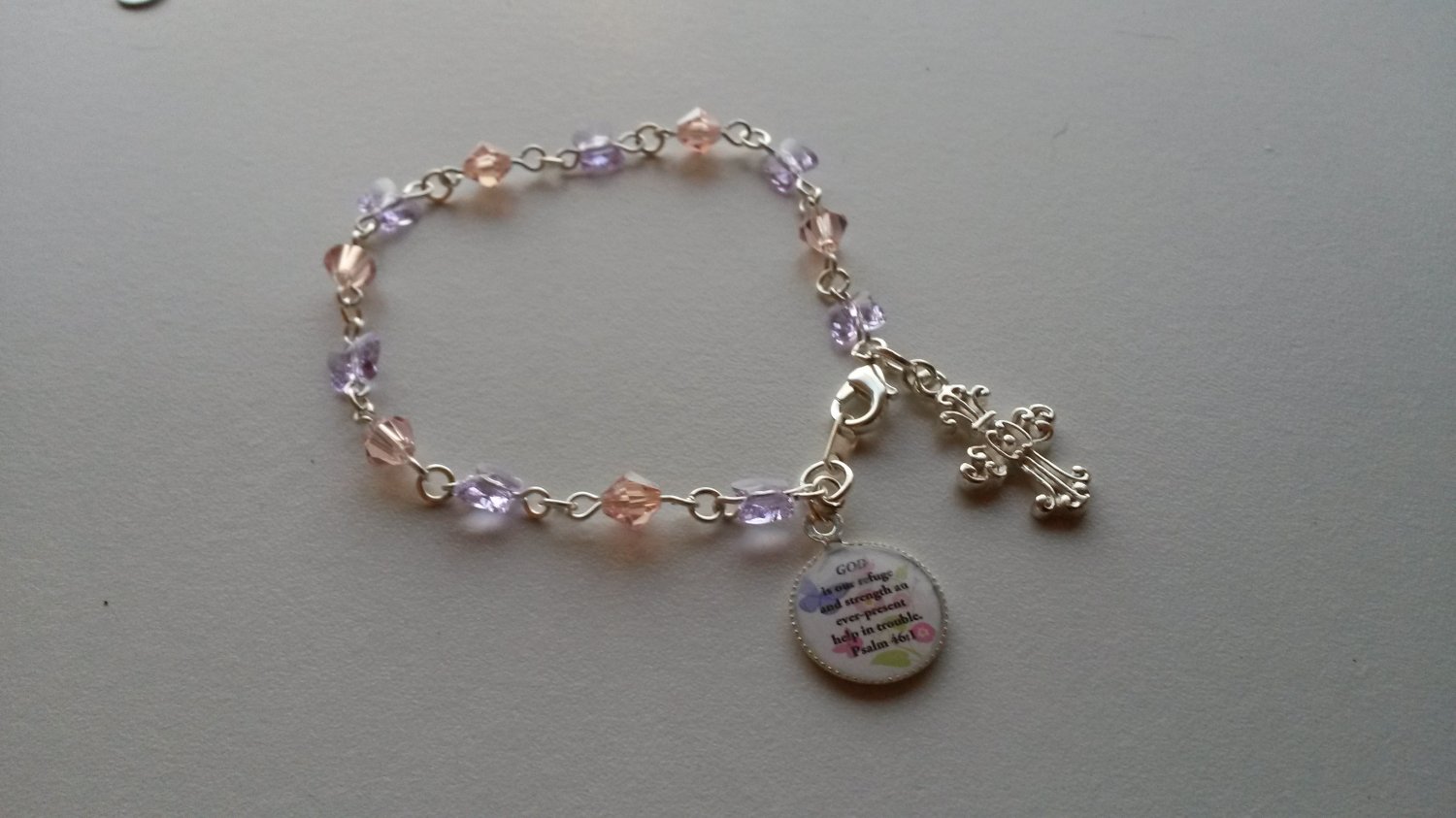 A pretty Swarovski butterflies and crystals bracelet w/Bible verse charm