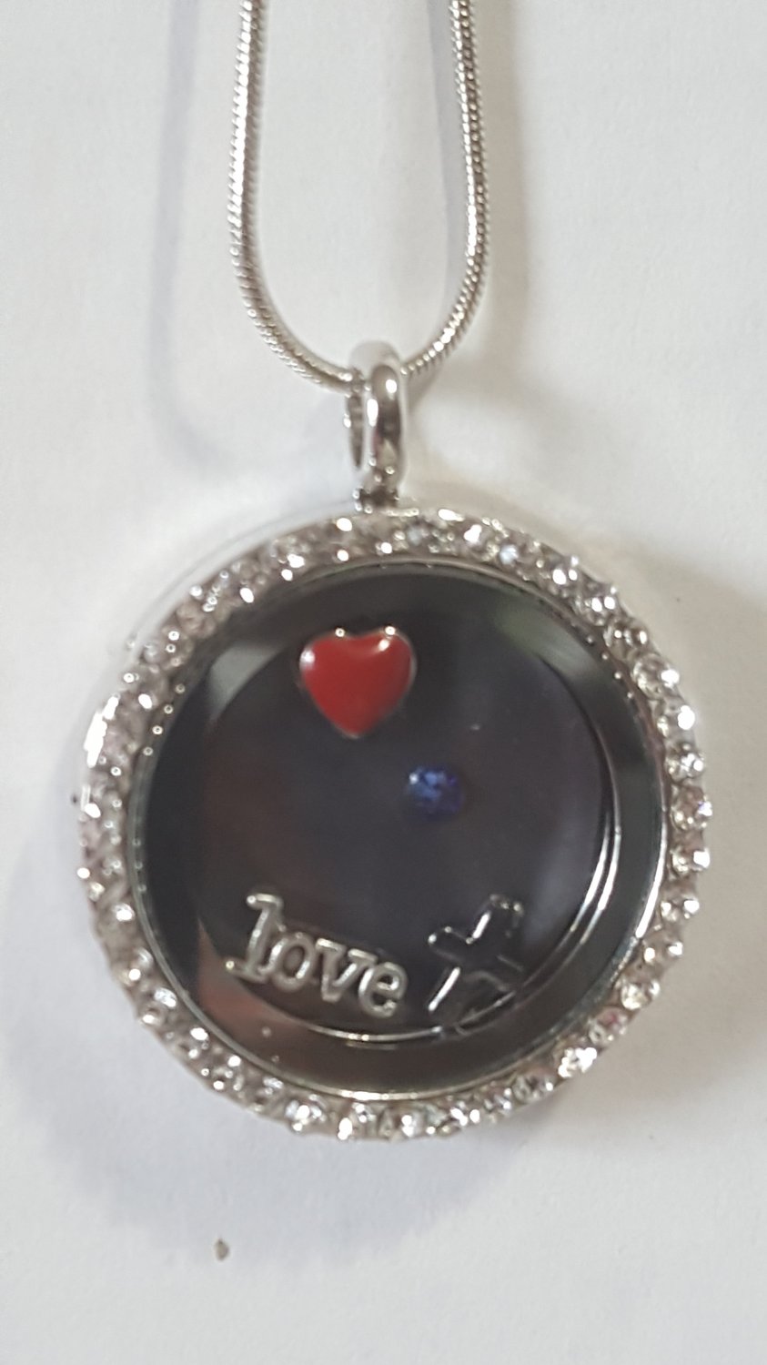 Floating Story Locket with magnetic insert and magnetic charms.