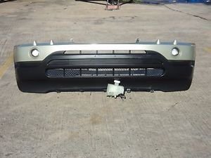 2000 BMW X5 FRONT BUMPER COVER WITH LEFT AND RIGHT FOG LIGHTS HEADLIGHT WASHER