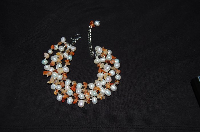 4 strand pearl w/ orange stone Bracelet B1120