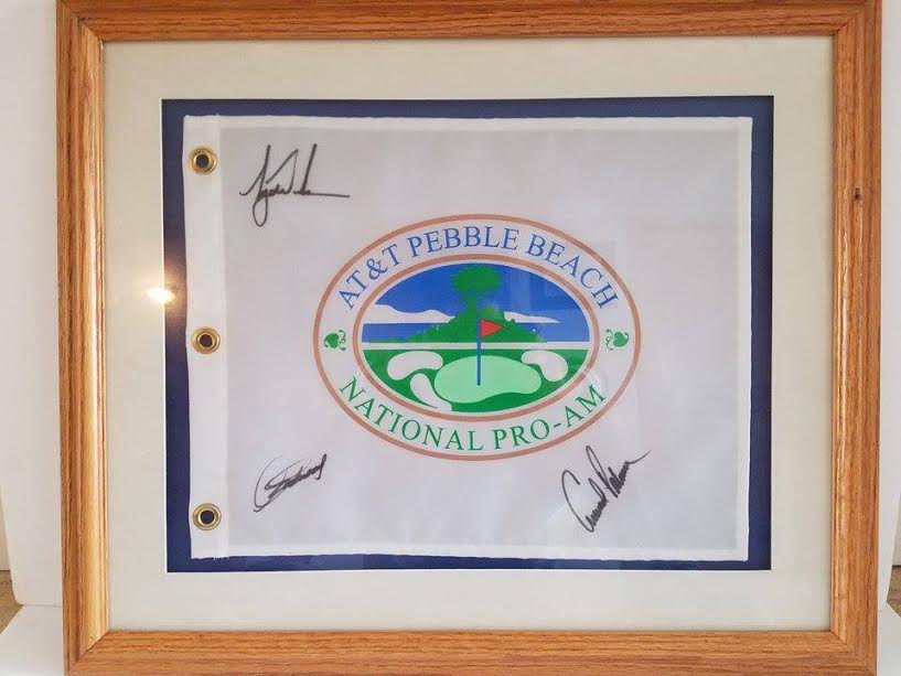 PEBBLE BEACH GOLF FLAG SIGNED BY ARNOLD PALMER, TIGER WOODS, AND CLINT EASTWOOD