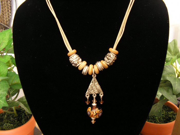 Casual and fun cotton cord necklace with shell , pewter and glass