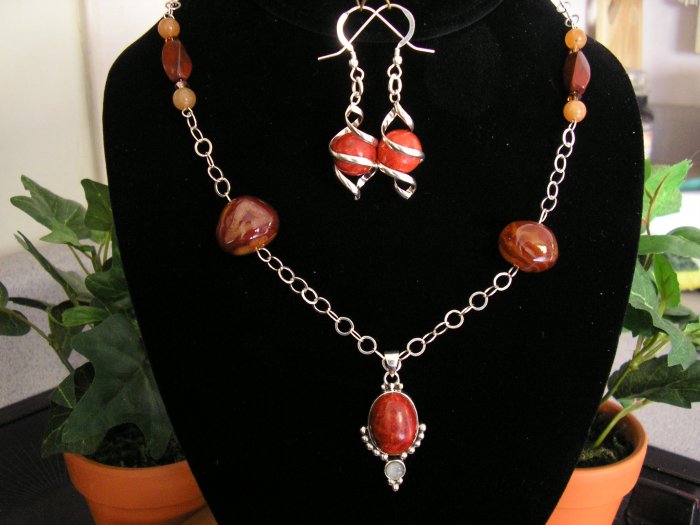 Sterling silver with obsidian and agate beads adorned with carnelian pendant