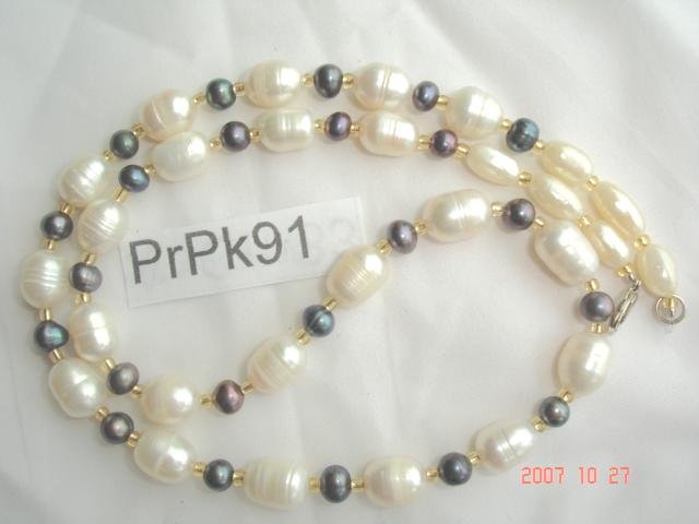 Genuine fresh water pearl necklace with rich luster color of peacock, peach, or mauve.
