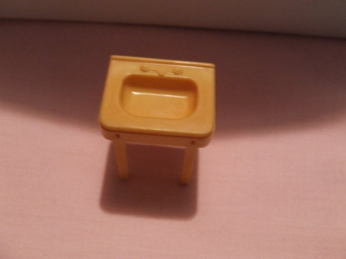 Dollhouse Furniture Molded gold plastic bathroom sink marked MARX