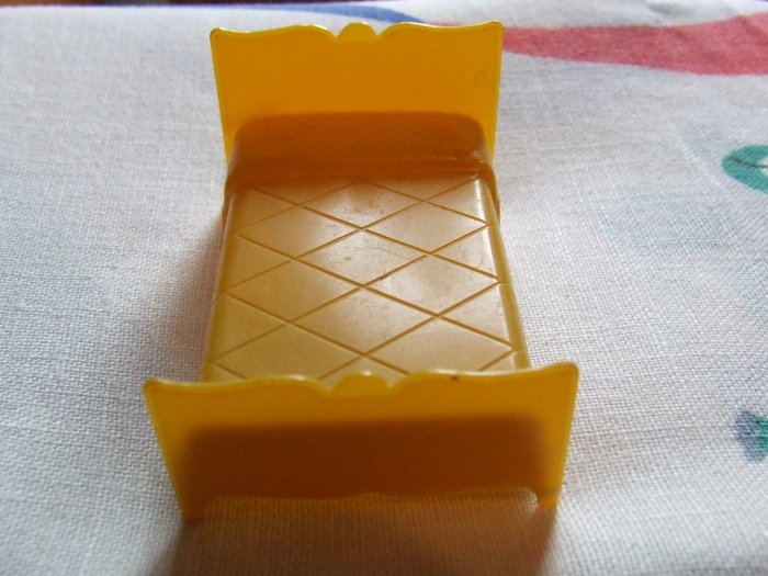 Dollhouse Furniture Molded Gold Plastic bed marked MARX $3.00 shipping included