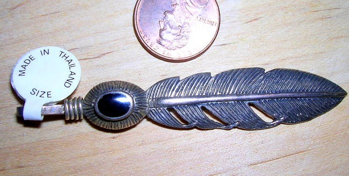 Silver feather pendant with onyx accent