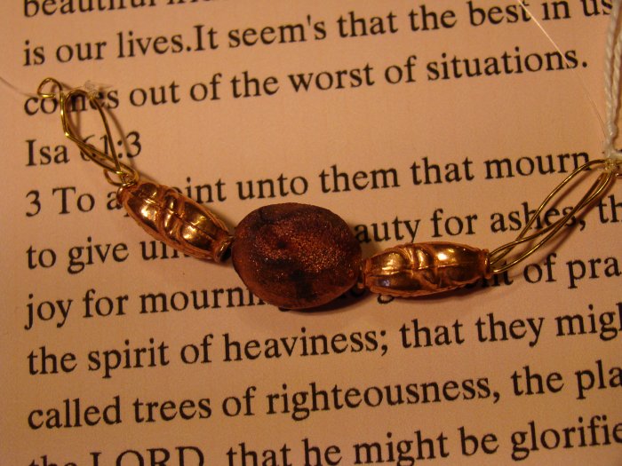 Raku with copper bead necklace