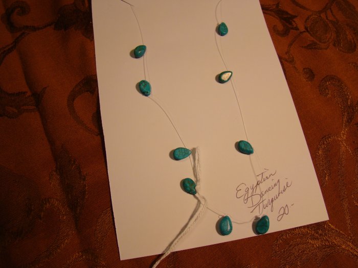 dancing egyptian floating necklace