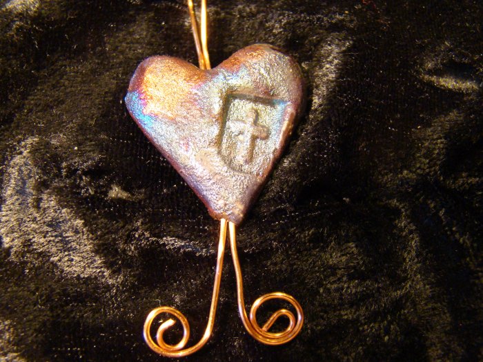 raku heart with cross pendant
