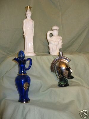 FOUR GRECIAN STYLE AVON DECANTERS/ USED/ NO BOXES k206