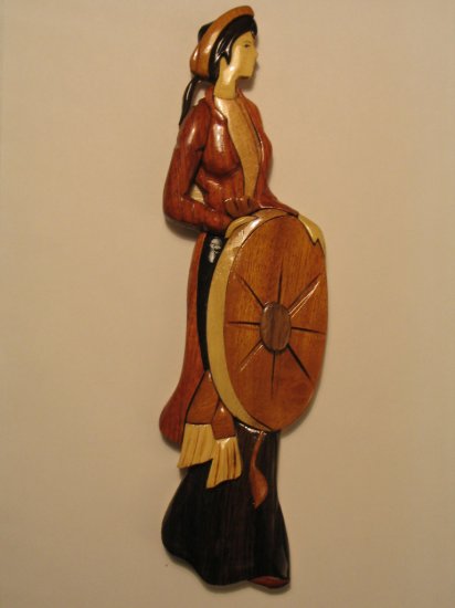 Wooden Northern girl in traditional dress