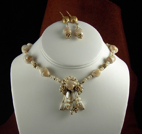 NATURAL MOTHER OF PEARL NUGGETS WITH PEWTER ACCENTS AND A CAGED DROP NECKLACE