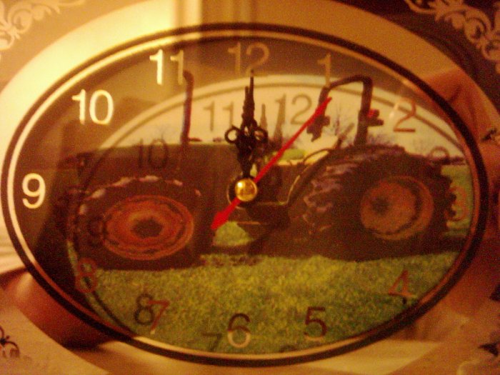 small glass clock with tractor