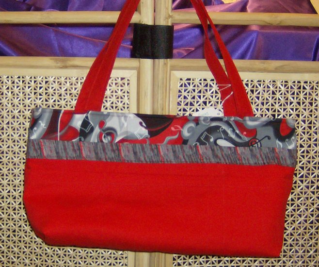 Red Handbag with Black Music Trim
