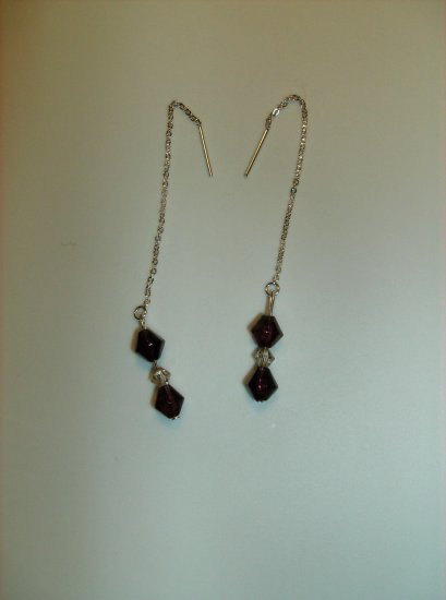 Drop earrings featuring garnet colored glass beads and cream pearls