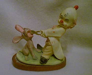 Clown Hobo Pulling Rabbits Tooth Figurine