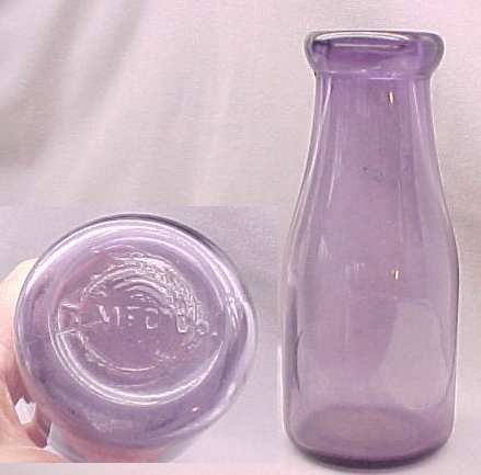 PURPLE VINTAGE MILK BOTTLE TMFC CO. NO STATE ONLY BOTTOM HAS EMB SEE PICTURE PINT p-469