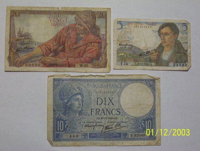 20, 10, and 5 Franc bills.