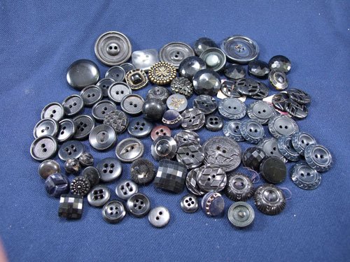 A Bag of Black Buttons Various Size and Shapes