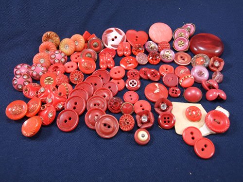 A Bag of Red Buttons Various Size and Shapes