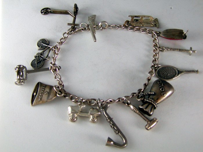 VINTAGE STERLING SILVER CHARM BRACELET AND CHARMS