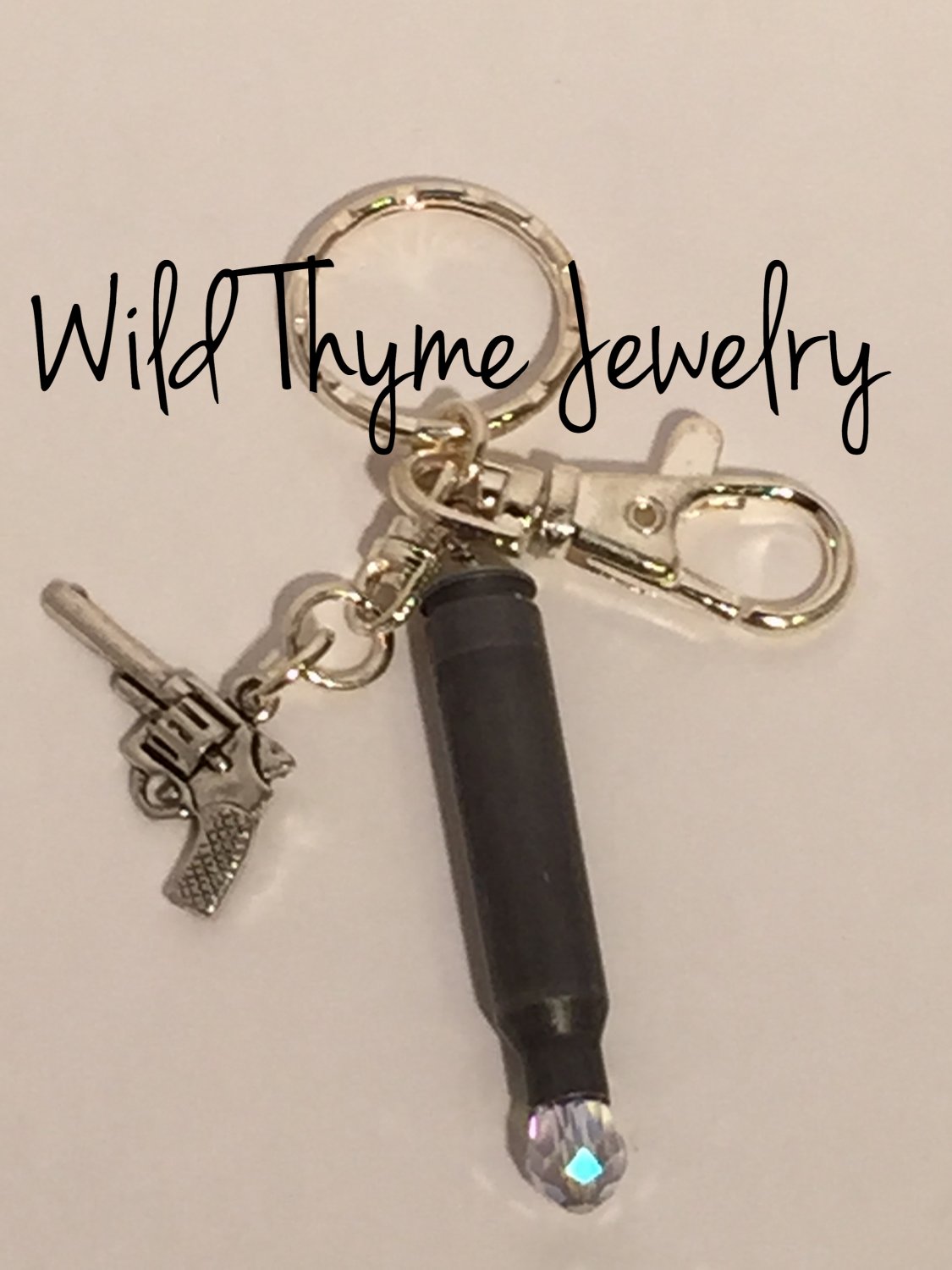 Bullet keychain with pistol charm