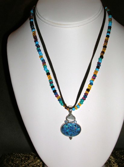 Beaded and leather necklace with blue and white pendant