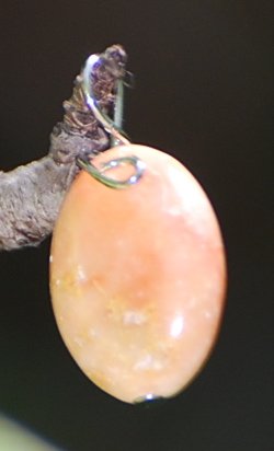 Oval hand wrapped charm