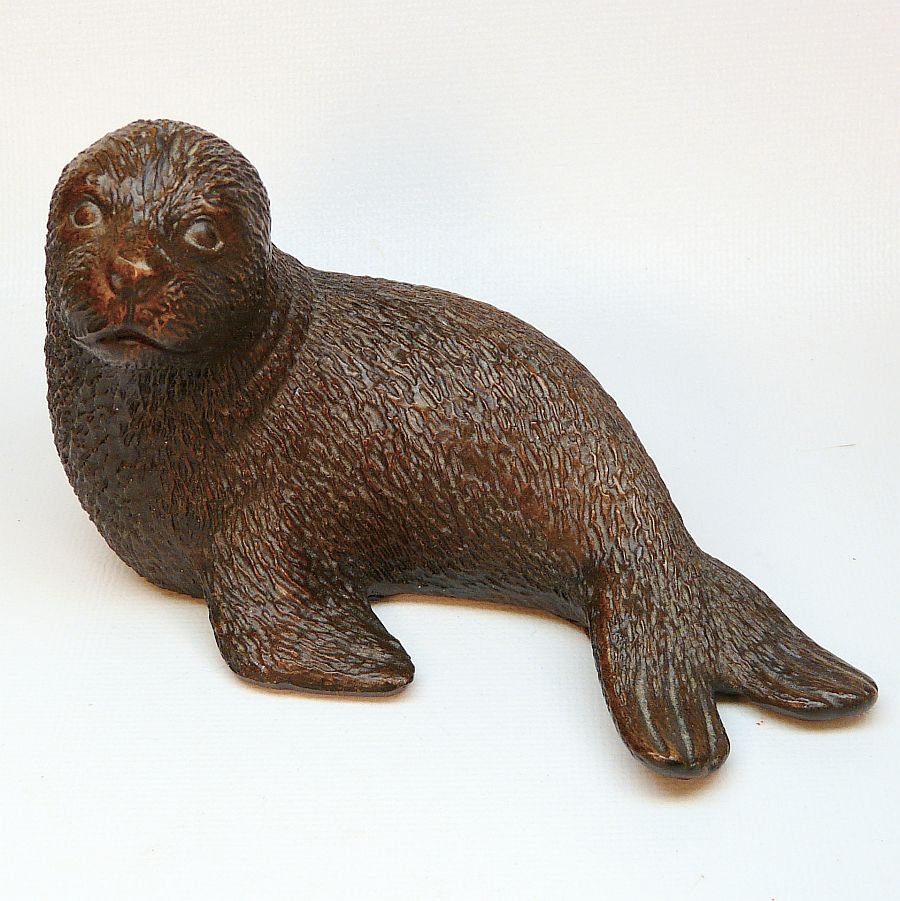 Red Mill Mfg seal figurine pecan shells dark brown