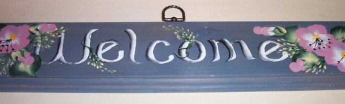 Welcome sign with blue gray background