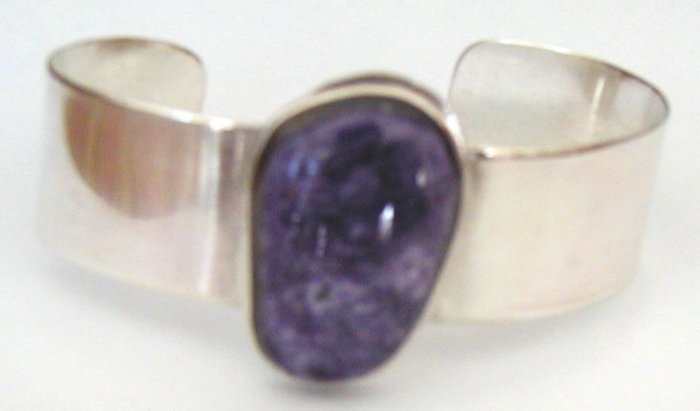 silver bracelet with large purple stone