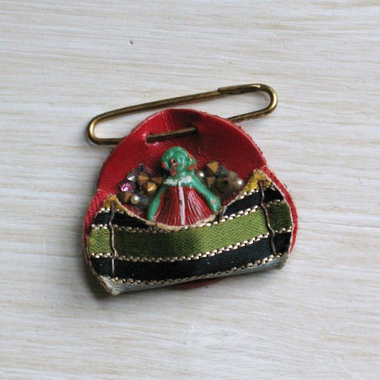 tiny green handpainted celluloid doll pin with rhinestones and leather - vintage jewelry