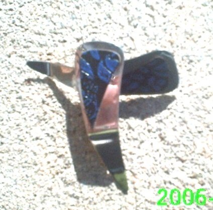 Black and blue leather flower stamped clip-on earrings