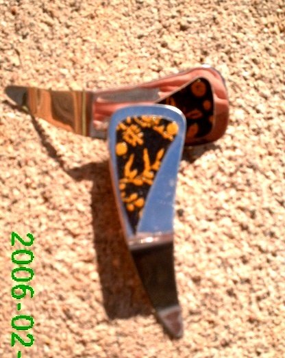 Black and gold flower stamped leather clip-on earrings