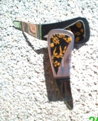 Black and gold flower stamped leather dangle earrings