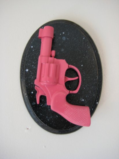 pink gun on black