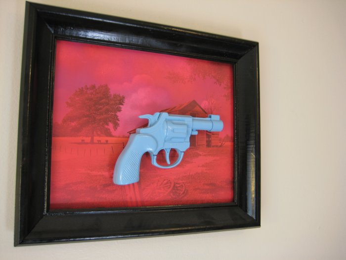 blue gun on pink and almost black