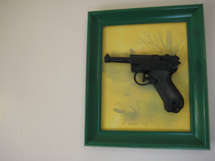 black gun on yellow and green