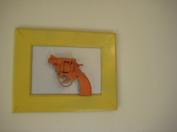 orange gun on silver and yellow